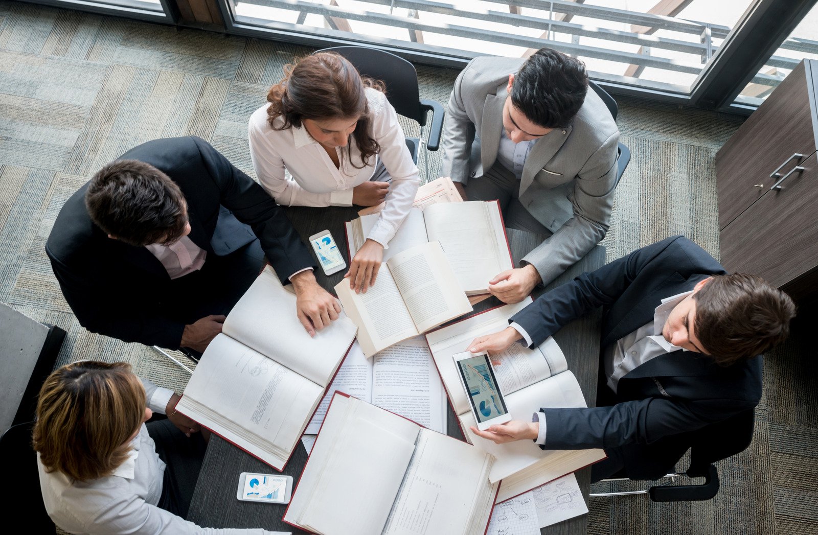 BBS Bookkeeping team working together around conference table